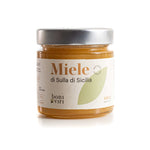 Miele biologico siciliano di ape sulla in barattolo